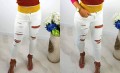 Obłędne spodnie jeans z dziurami Slim Fit białe